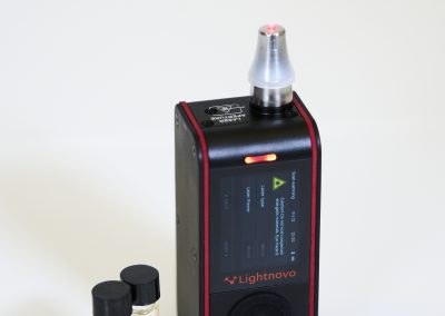 Close-up of miniRaman spectrometer with vial holder attachment