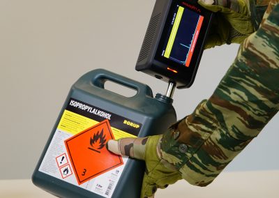 RG spectrometer identifying hazardous chemical container in field use