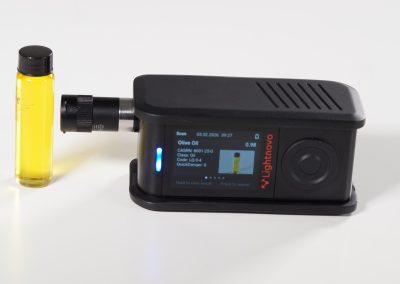 Side view of portable miniRaman spectrometer during material identification