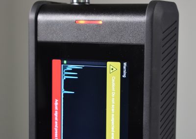 Close-up of RG Pro Spectrometer screen displaying spectral analysis graph and measurement data